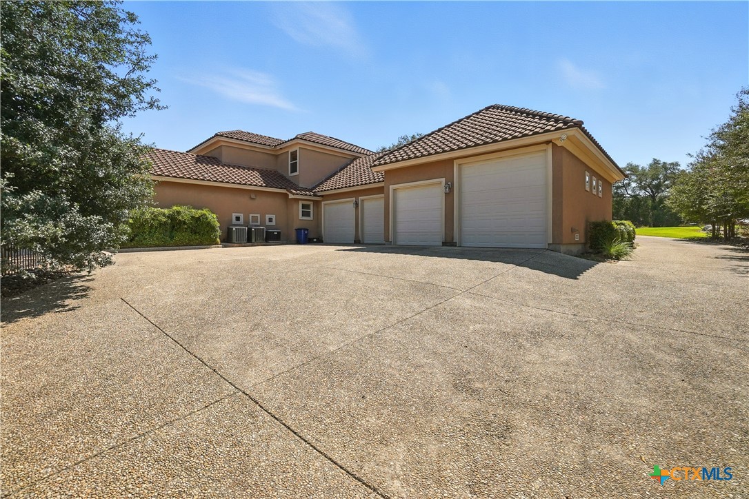 7607 Sky Loop Garden Ridge, TX 78266 - Photo 36 of 43 a front view of a house with a yard and garage