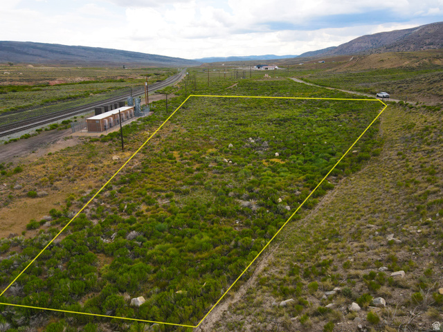 25315 South UDOT Access Road East Helper, UT 84526 - Photo 8 of 20 Expansive undeveloped land parcel with varied natural vegetation and a gentle slope