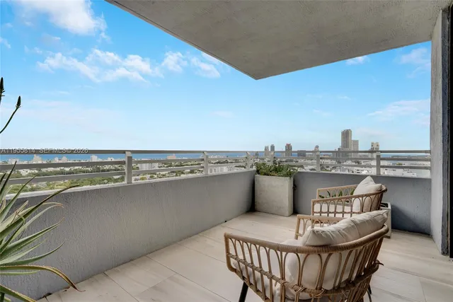 a terrace with a table and chairs