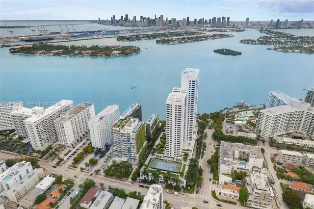 a view of a lake with tall buildings