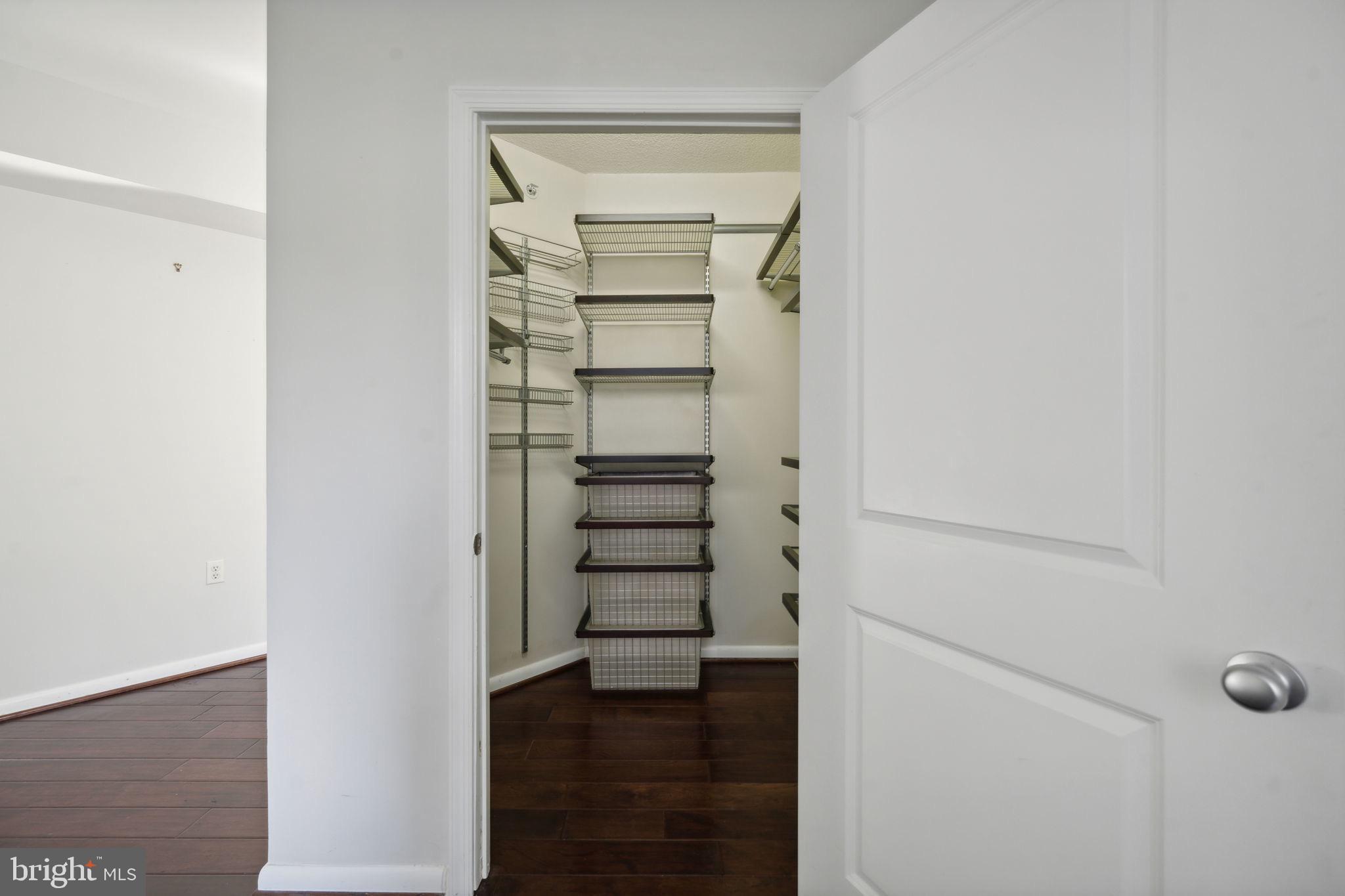 851 North Glebe Road, Unit 604 Arlington, VA 22203 - Photo 15 of 58 a view of walk in closet with empty racks