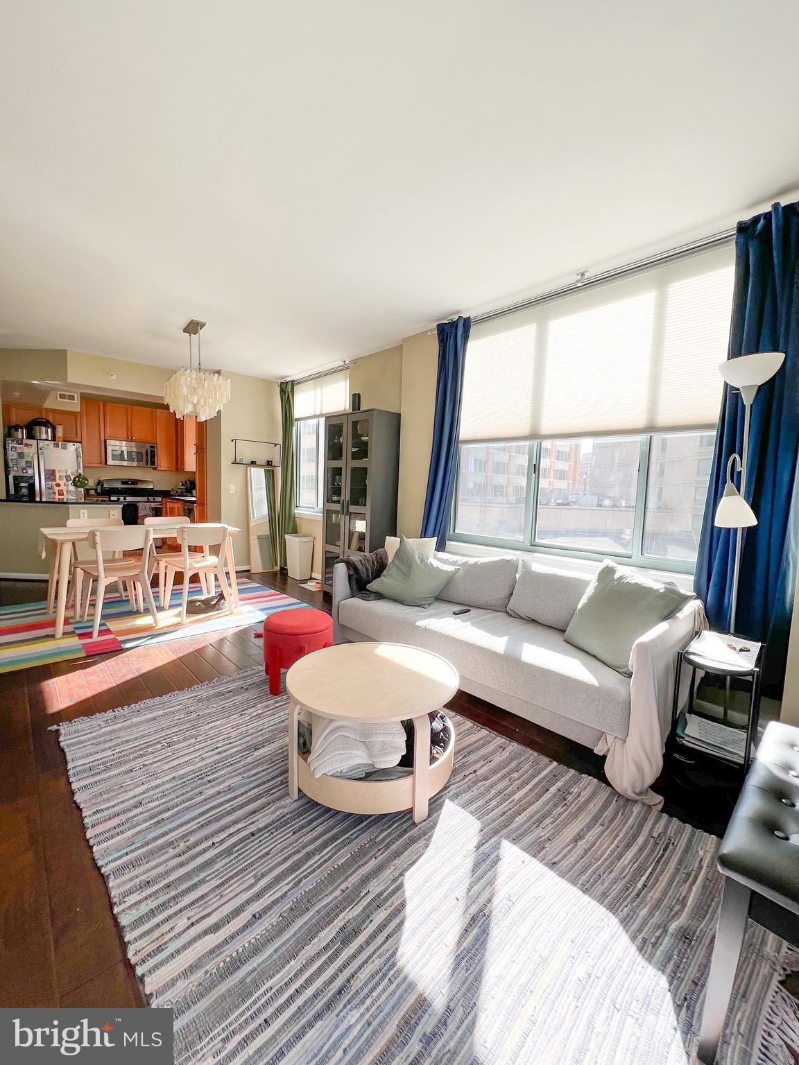851 North Glebe Road, Unit 604 Arlington, VA 22203 - Photo 23 of 58 a living room with furniture and a large window