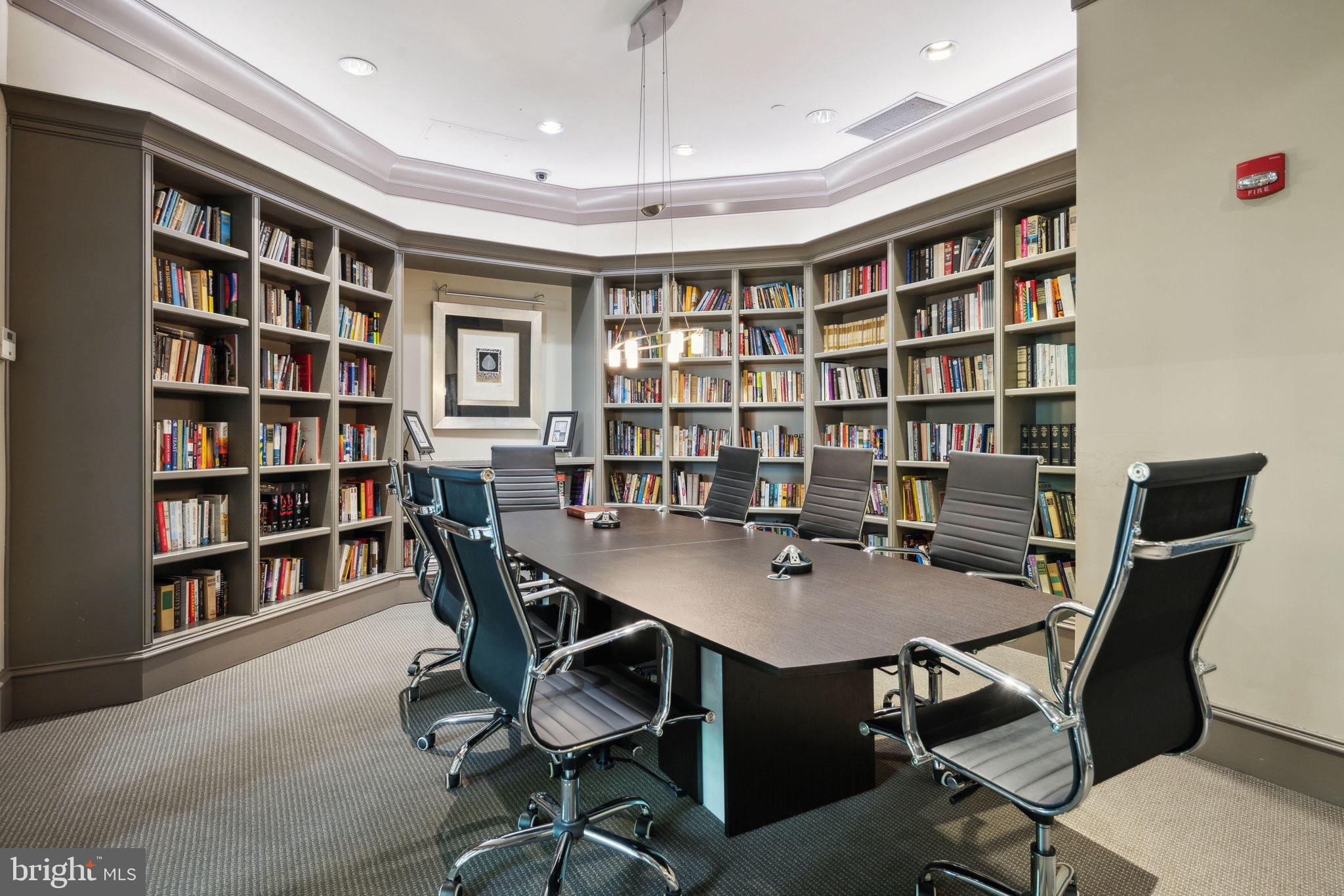 851 North Glebe Road, Unit 604 Arlington, VA 22203 - Photo 27 of 58 a view of a workspace with furniture and a bookshelf