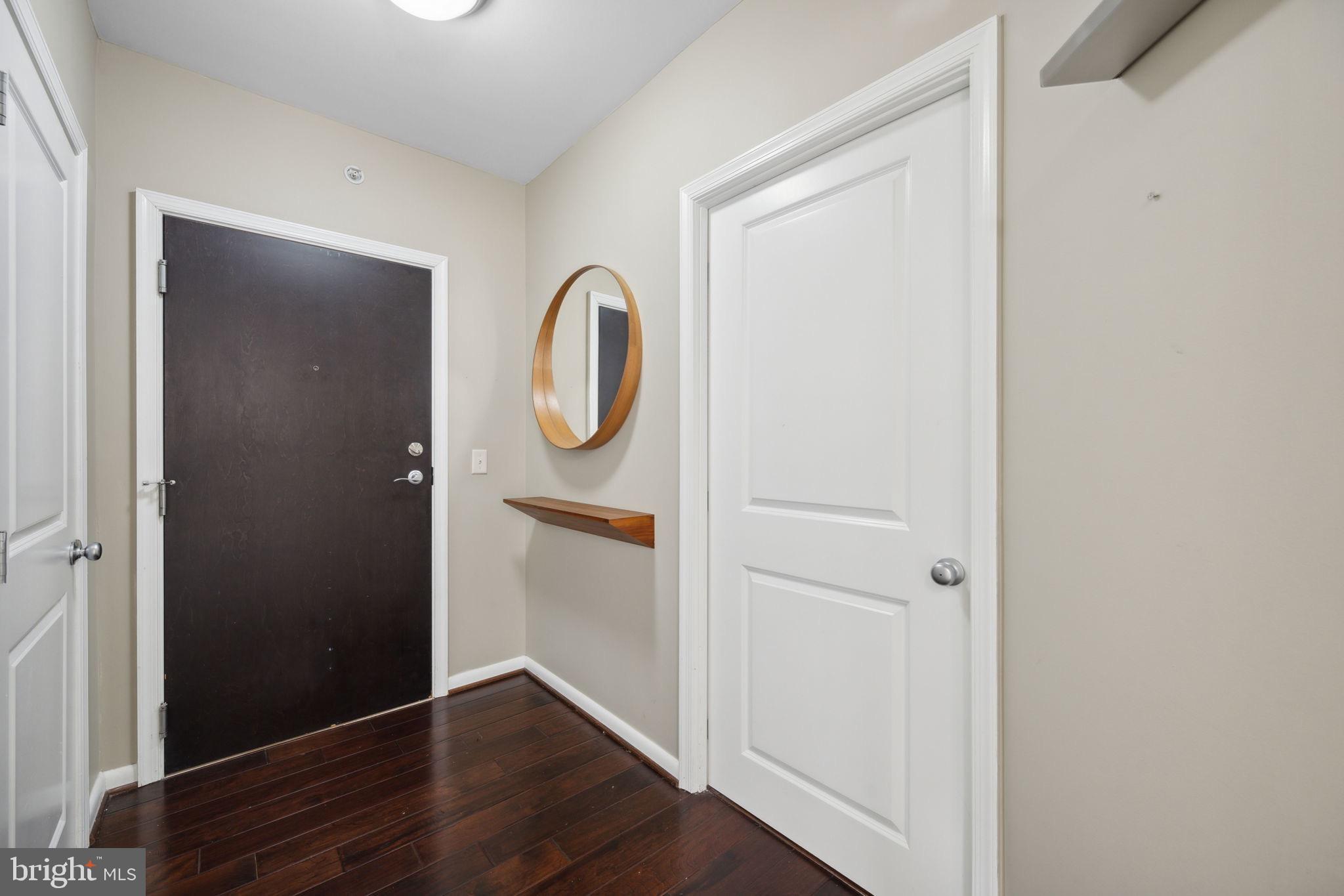 851 North Glebe Road, Unit 604 Arlington, VA 22203 - Photo 3 of 58 a view of a hallway with wooden floor