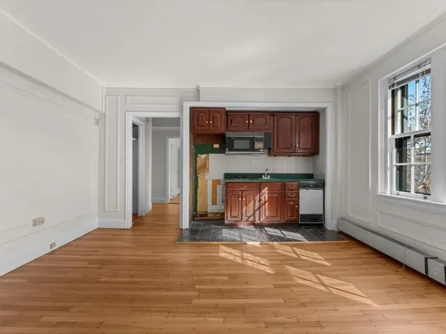 a view of a kitchen with a sink cabinets and a window