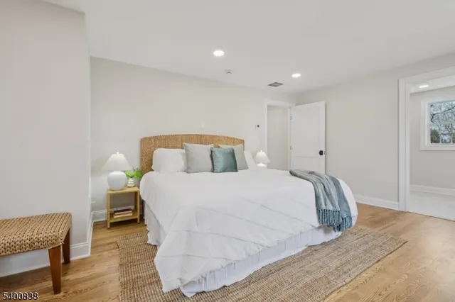 a bedroom with a bed and a chair