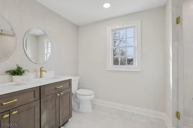 a living room with furniture and a book shelf