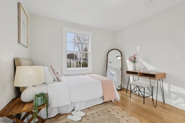 a bedroom with a bed and a table