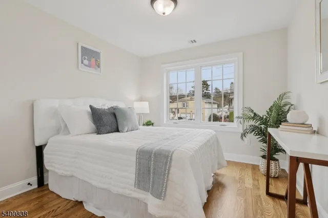 a bedroom with a bed and a lamp