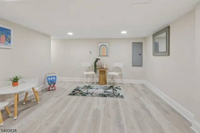 a bathroom with a sink mirror and toilet
