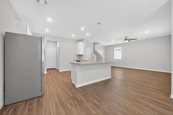 a view of kitchen with wooden floor