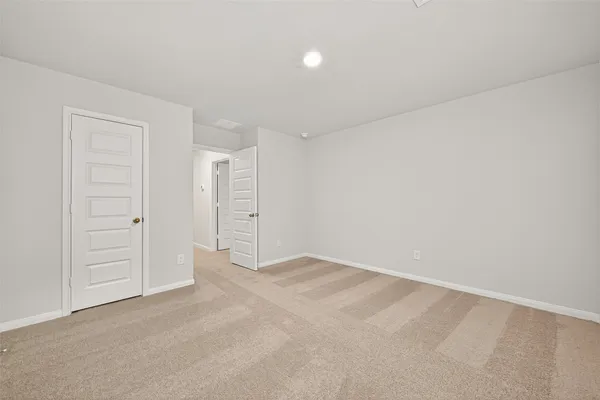an empty room with closet area