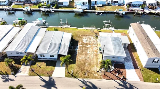 a view of a lake with chairs