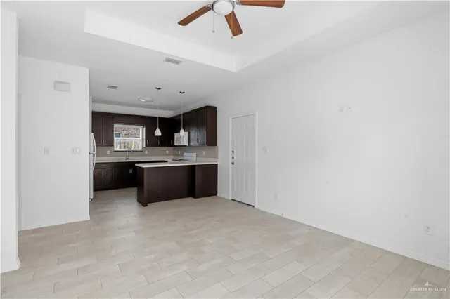 a large kitchen with a cabinets and window