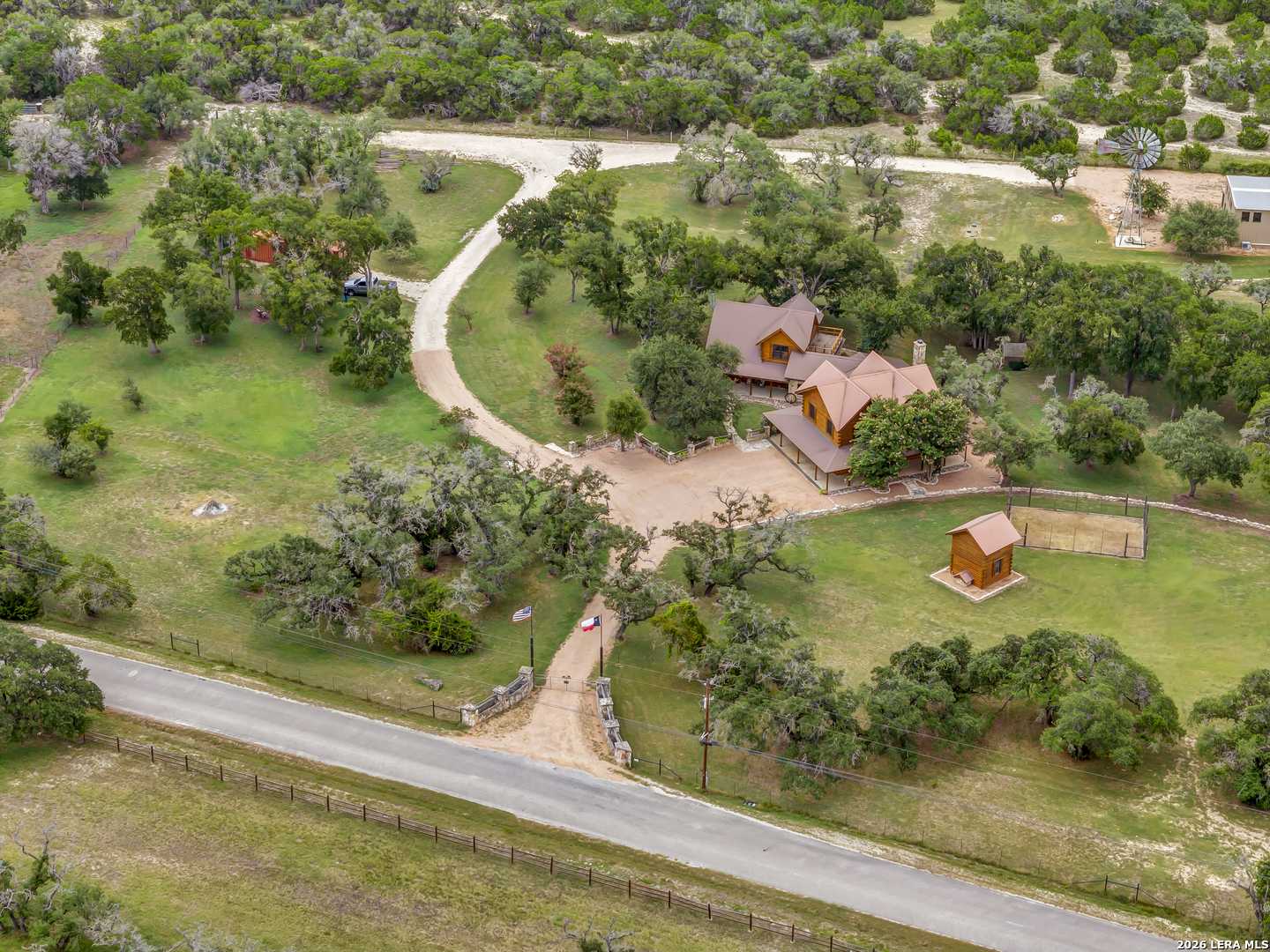 700 Ledgerock Road Wimberley, TX 78676 - Photo 7 of 38 an aerial view of a residential houses with outdoor space and trees all around