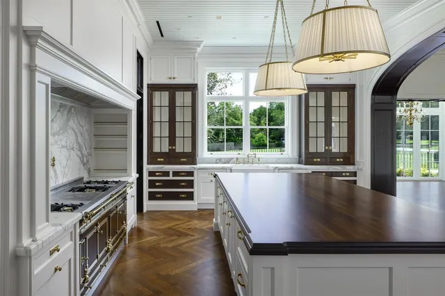 a kitchen with granite countertop a sink and a stove