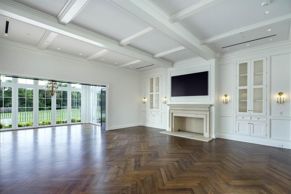 4606 Park Lane Dallas, TX 75220 - Photo 15 of 40 a view of an empty room with wooden floor fireplace and a window