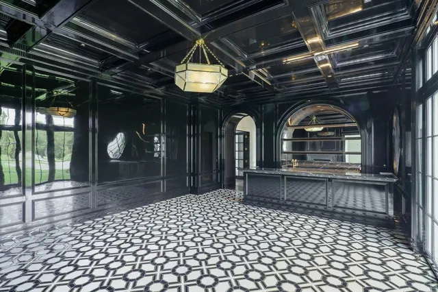 a view of hall way with furniture