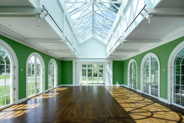 a view of a livingroom with a fireplace and window