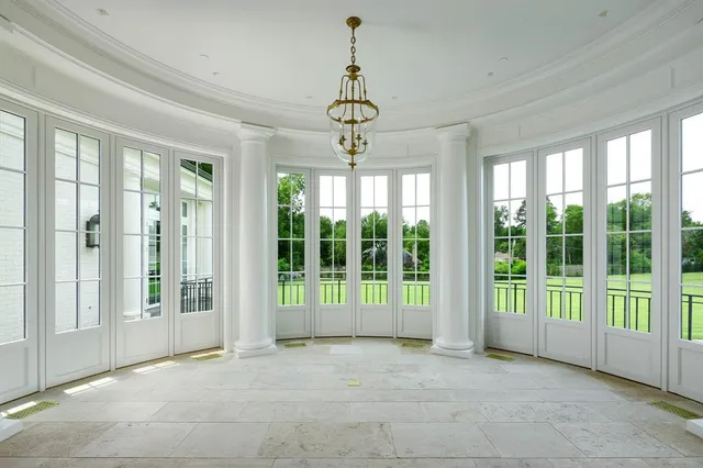 a spacious bathroom with a granite countertop sink a mirror and shower