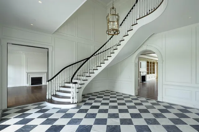 a view of entryway with white walls and black white checkered floor