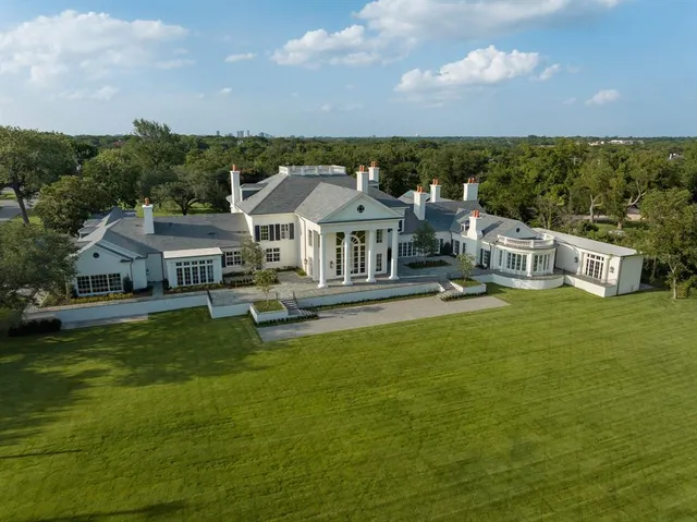 an aerial view of a house with outdoor space pool seating area and yard