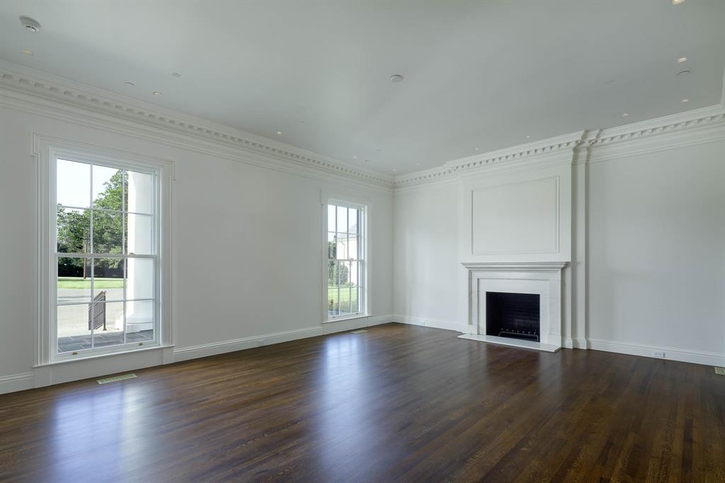 4606 Park Lane Dallas, TX 75220 - Photo 4 of 40 a view of an empty room with wooden floor and a window