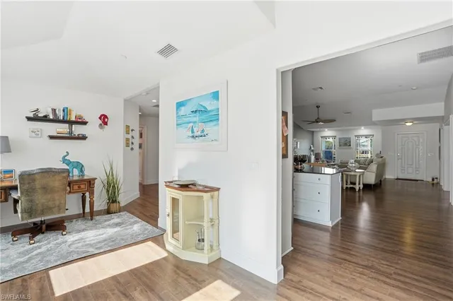 a living room with furniture and a table