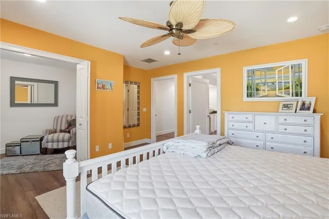 a bedroom with a bed and a dresser