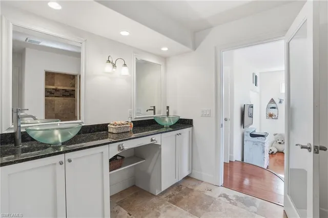 a living room with furniture a rug and a window