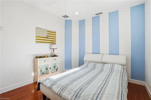 a bathroom with a sink mirror and vanity