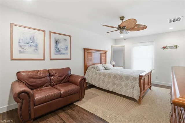 a bedroom with a bed and a view of bathroom