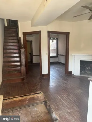 a view of livingroom with hardwood floor and fireplace