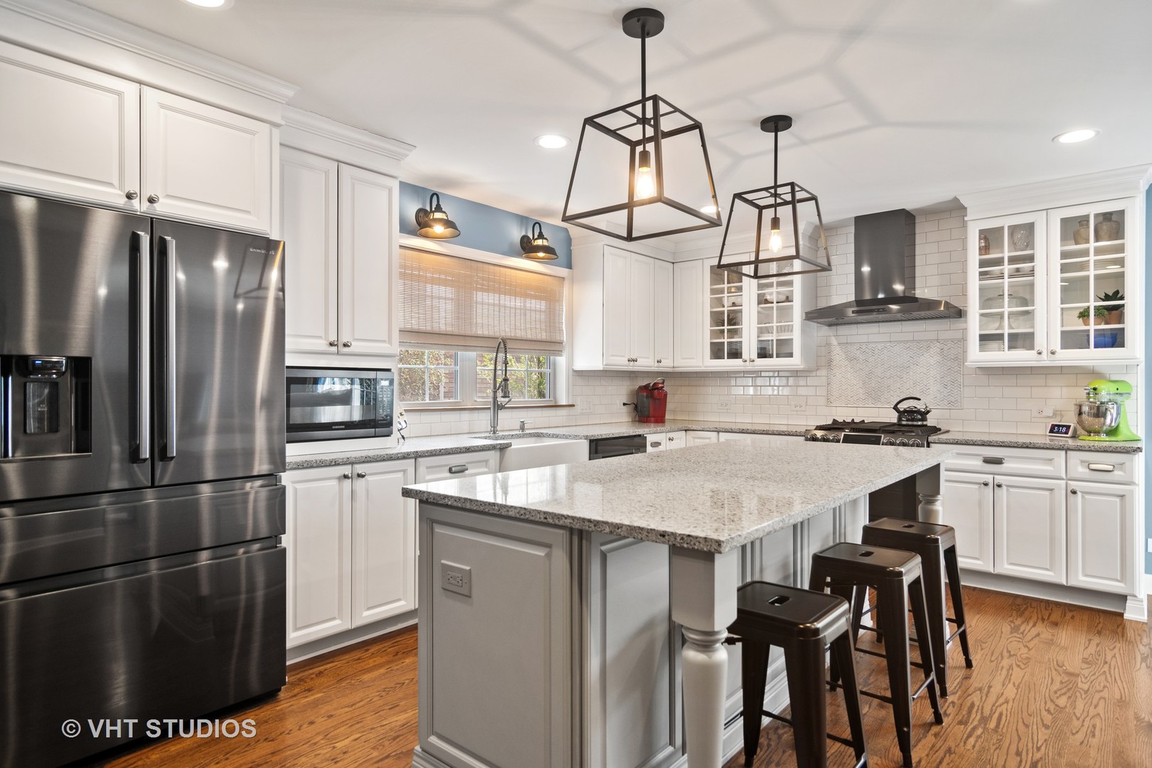624 South Banbury Road Arlington Heights, IL 60005 - Photo 6 of 20 a kitchen with stainless steel appliances granite countertop a sink a stove a refrigerator cabinets and chairs