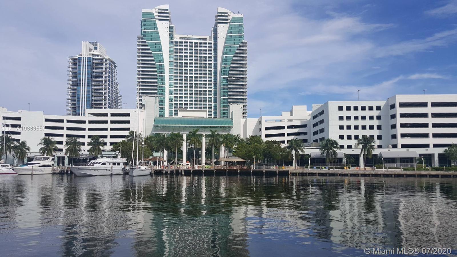 a view of a water with tall building