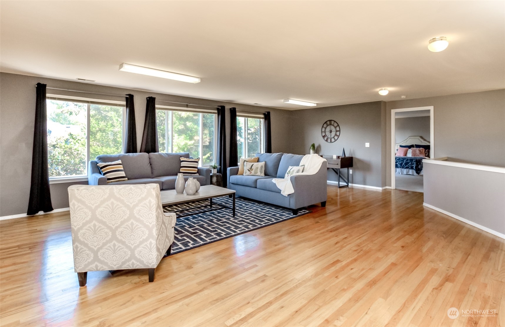 4609 Northeast 7th Place Renton, WA 98059 - Photo 14 of 30 a living room with furniture and wooden floor
