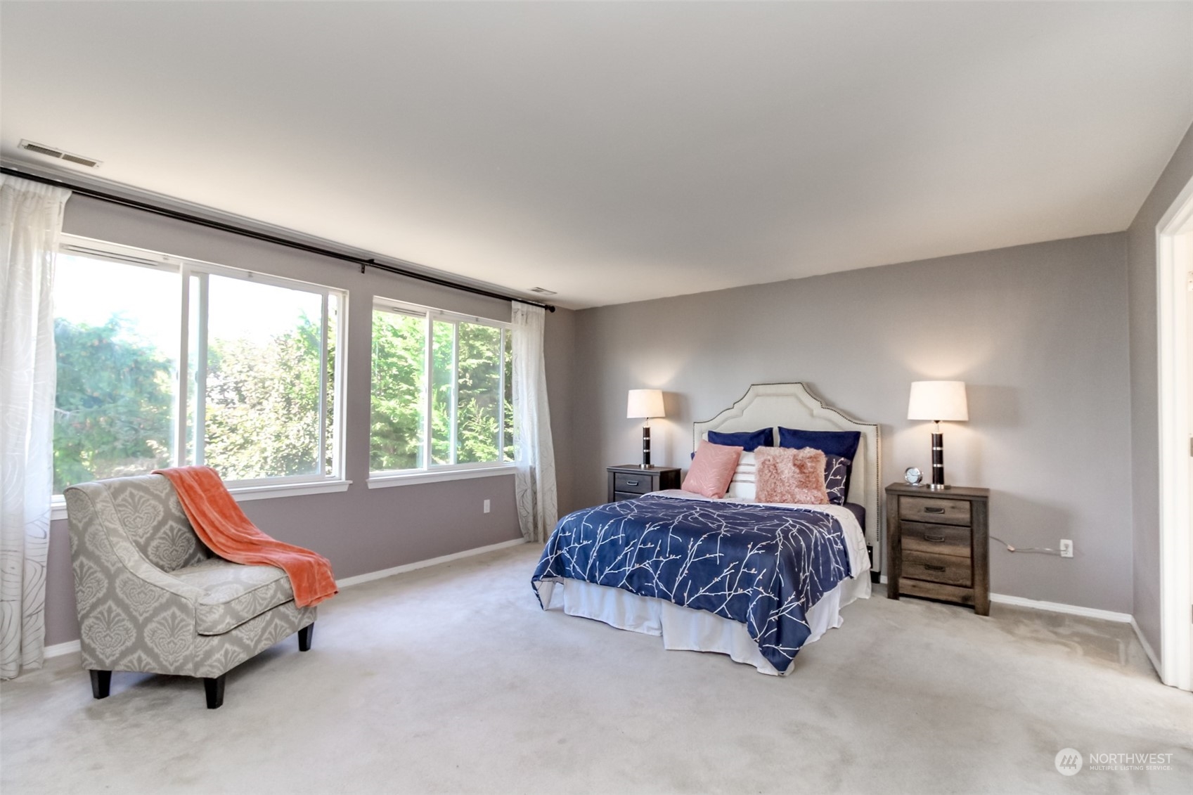 4609 Northeast 7th Place Renton, WA 98059 - Photo 16 of 30 a bedroom with a bed and a couch