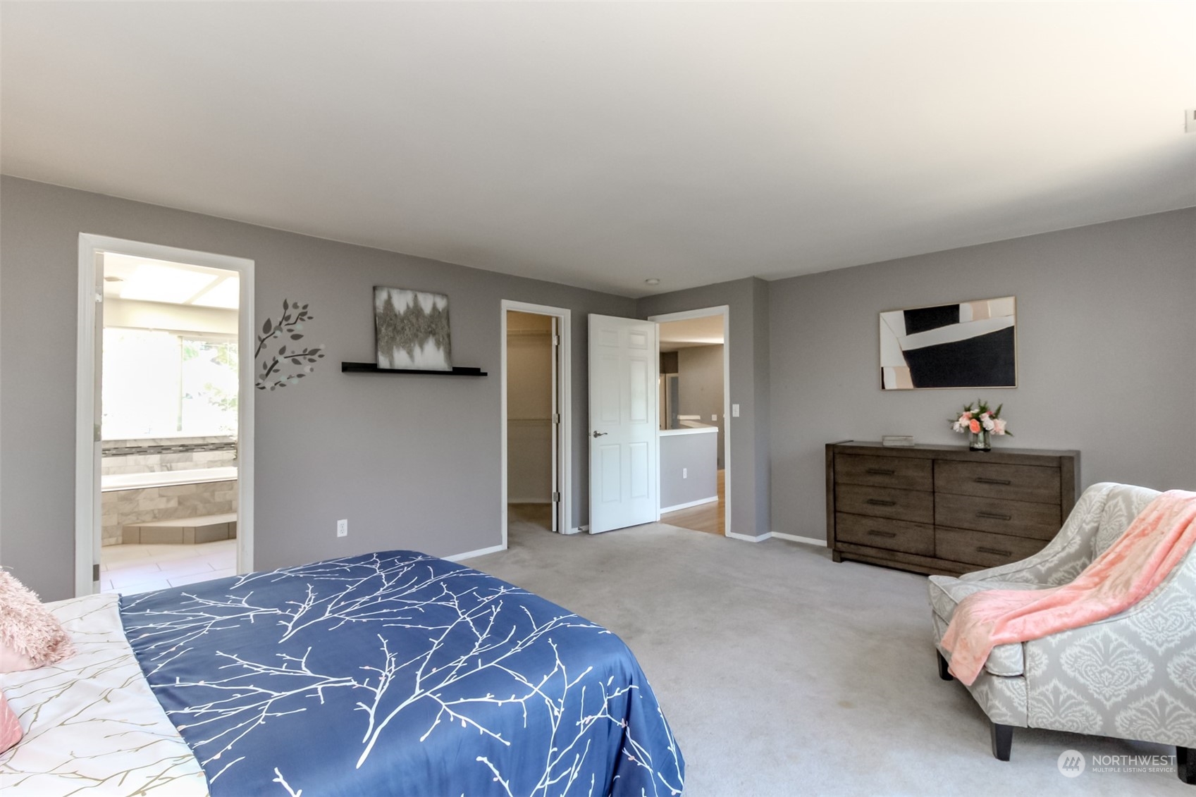 4609 Northeast 7th Place Renton, WA 98059 - Photo 17 of 30 a bedroom with a bed and flat screen tv