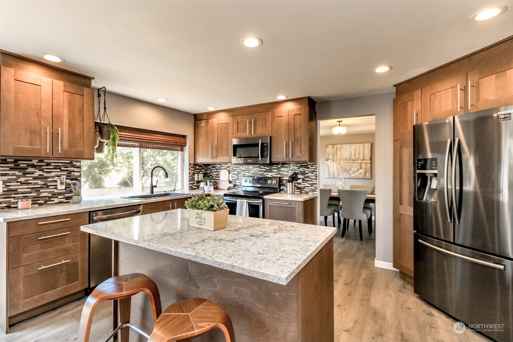 4609 Northeast 7th Place Renton, WA 98059 - Photo 2 of 30 a kitchen with kitchen island a counter space and stainless steel appliances