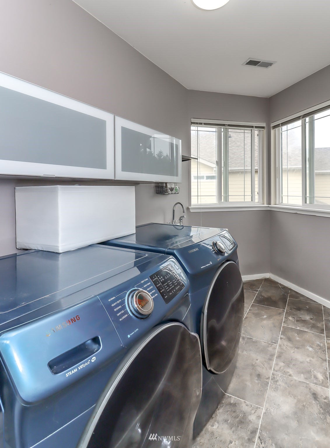4609 Northeast 7th Place Renton, WA 98059 - Photo 22 of 30 a kitchen with a stove and a sink