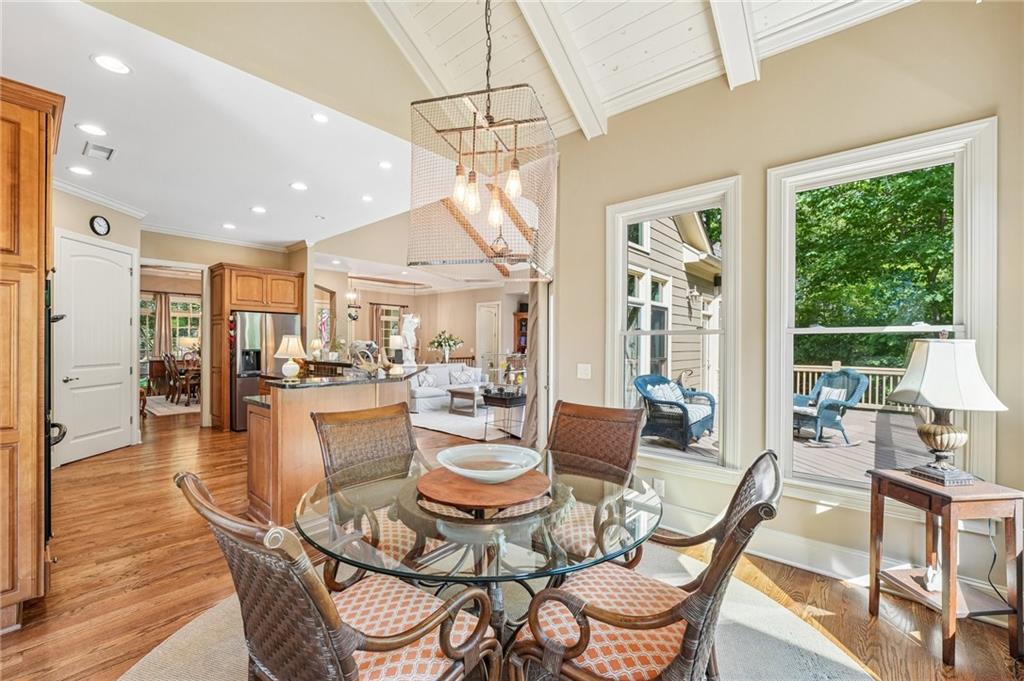 189 Red Trillium Ridge Big Canoe, GA 30143 - Photo 22 of 98 a dining room with furniture a chandelier and wooden floor