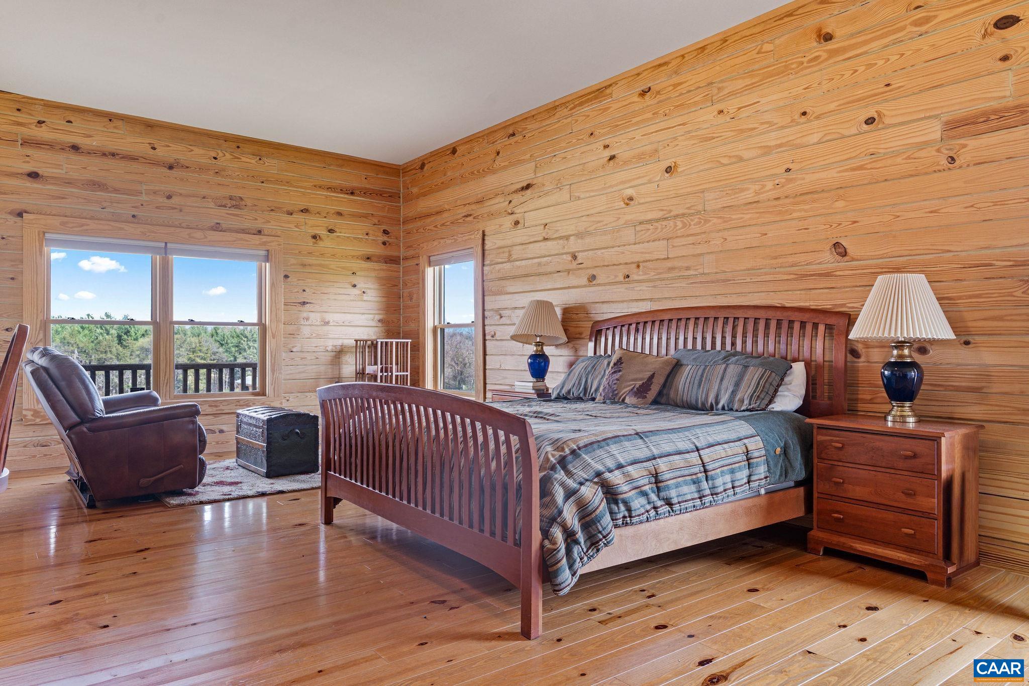 42 River Ridge Lane Stanardsville, VA 22973 - Photo 25 of 70 a bedroom with a bed and wooden floor