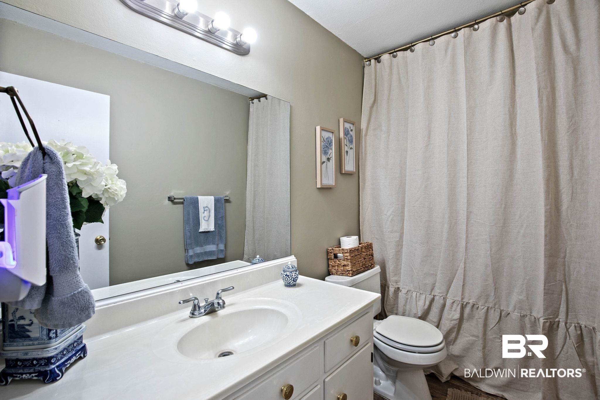 4 Rally Road Spanish Fort, AL 36527 - Photo 30 of 41 Full bathroom with vanity and curtained shower