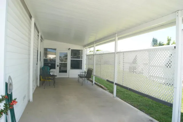 a view of a balcony with chairs
