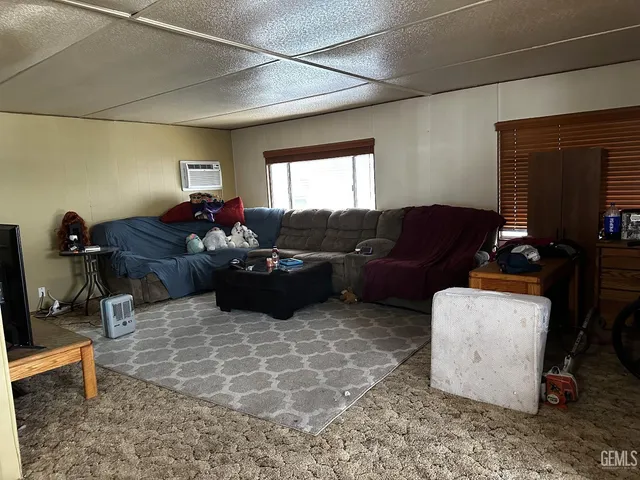 a room with furniture and a flat screen tv