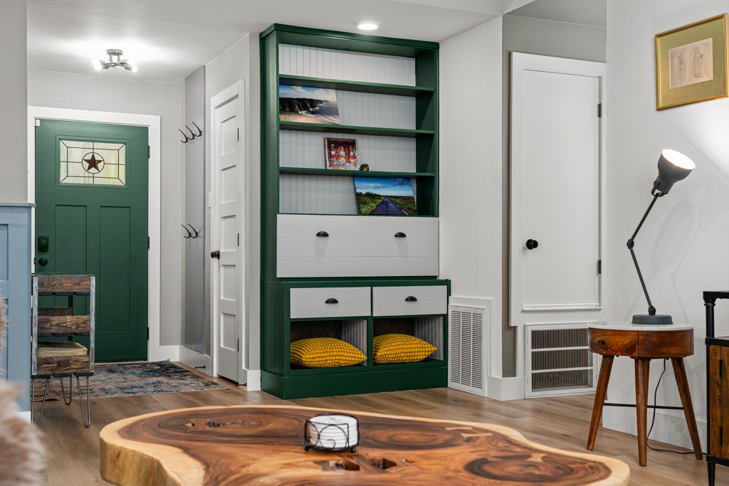 1502 Quail Run Road Pflugerville, TX 78660 - Photo 11 of 37 A dark green front door with a star motif opens to a bright, inviting entryway.