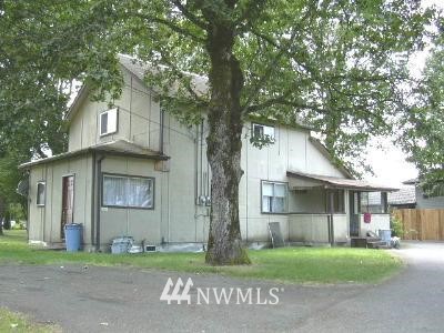 565 McNaught Road South Roy, WA 98580 - Photo 1 of 1 a front view of a house with a garden and trees
