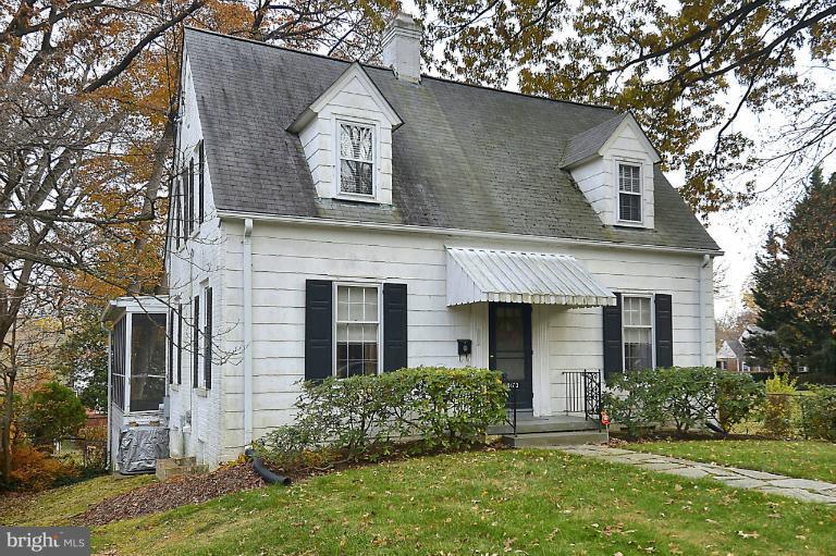 10163 Sutherland Road Silver Spring, MD 20901 - Photo 2 of 28 front view of a house with a yard