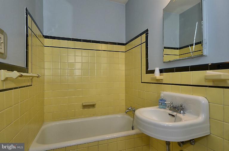 10163 Sutherland Road Silver Spring, MD 20901 - Photo 15 of 28 a bathroom with a sink and a bathtub