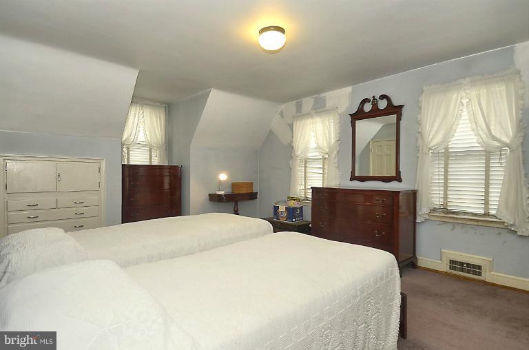 10163 Sutherland Road Silver Spring, MD 20901 - Photo 23 of 28 a bedroom with a large bed and a window